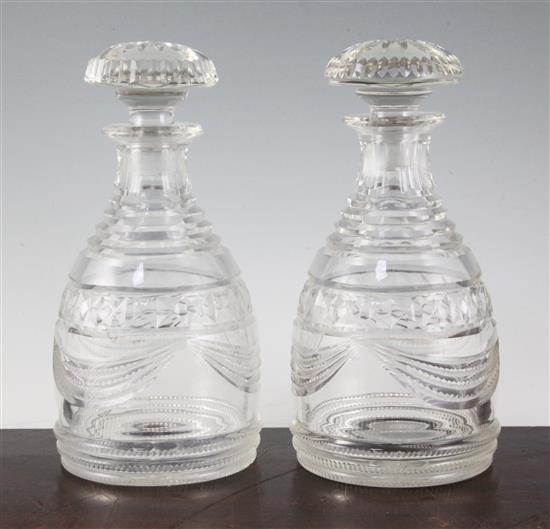 A pair of Regency Irish cut glass mallet form decanters and stoppers, height 25cm